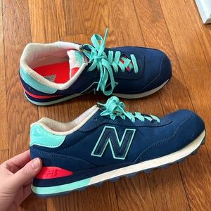 Navy with pink and teal new balance. Only worn 2-3 Times. Size 8.5